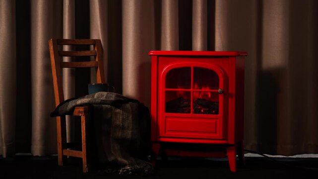 A warm and inviting winter scene with a retro red fireplace.