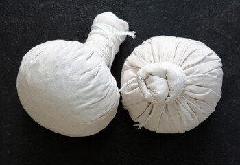 Herbal compress ball and Thai herbs for aromatherapy massage, Thai massage, traditional massage, Traditional herbal compresses are wrapped in natural cloth.