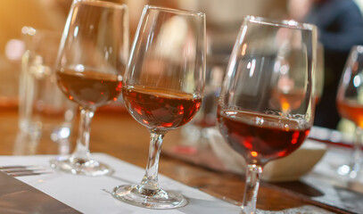 Naklejka premium Wine and port tasting in glasses on the table.