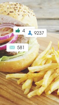 Vertical video: Frame three burger and fries drawing icons, popping, grouping, fading, showing buzz