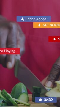 Vertical video: Senior cook holding avocado removing pit slicing cucumber for prep overlays popping