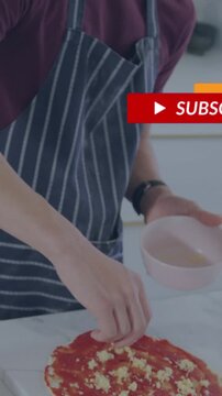 Vertical video: Teen cook making pizza adding cheese dipping into pink bowl causing social popups