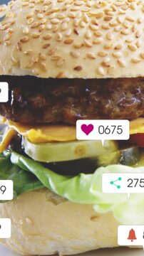 Vertical video: Camera pulling back, sesame burger getting icons, counts changing and showing buzz