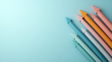 Fototapeta premium A dynamic array of colorful arrows pointing forward against a light blue backdrop, representing progress, direction, and creative design in a visually pleasing way.