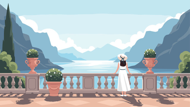 Woman in white dress enjoying scenic mountain lake view from balcony