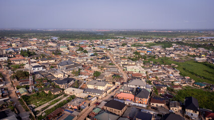 Fototapeta premium lush green vegetation scattered in-between urban civilization.