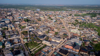 Fototapeta premium lush green vegetation scattered in-between urban civilization.