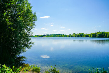 View of Lake Lippe and the surrounding green landscape. Nature by the lake near Paderborn.

