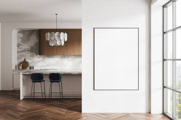 Fototapeta premium Modern kitchen interior with wooden accents, marble wall, and large empty poster frame on white wall next to window in minimalist apartment space. 3D Rendering