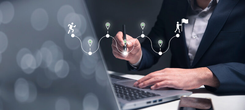 Career path journey concept with a hand pointing toward the final destination, symbolizing ambition, planning, milestones, and strategic career development toward success.