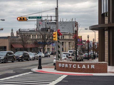 MONTCLAIR, NEW JERSEY, USA - NOVEMBER 22, 2019:   View of downtown Montclair with Town sign at the Junction of Broomfield Ave and Orange Road