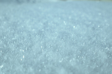 Obraz premium Macro shot of soft sparkling blue crystalline snow texture.