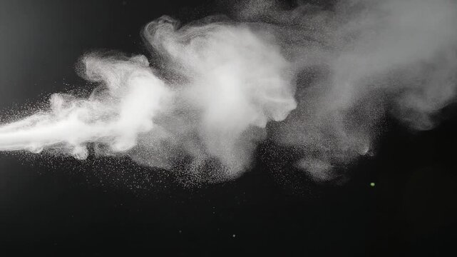A dynamic stream of white smoke or vapor dispersing against a dark background.