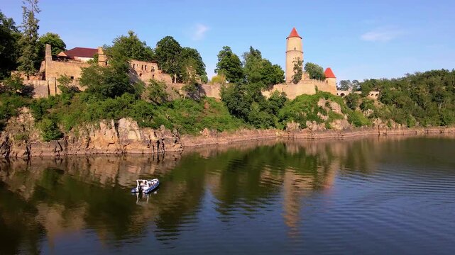 A motorboat anchored near the medieval Zvikov Castle in Czech Republic