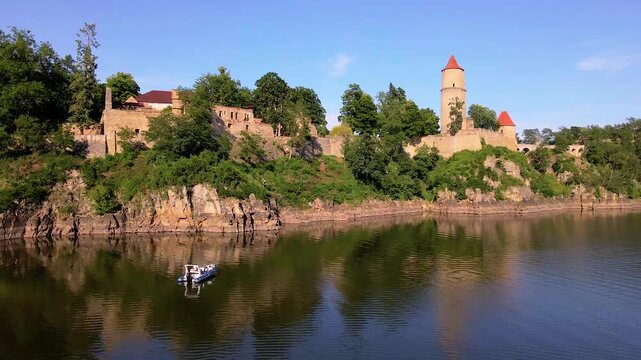 Boat near the ancient walls of Zvikov Castle at Orlik lake
