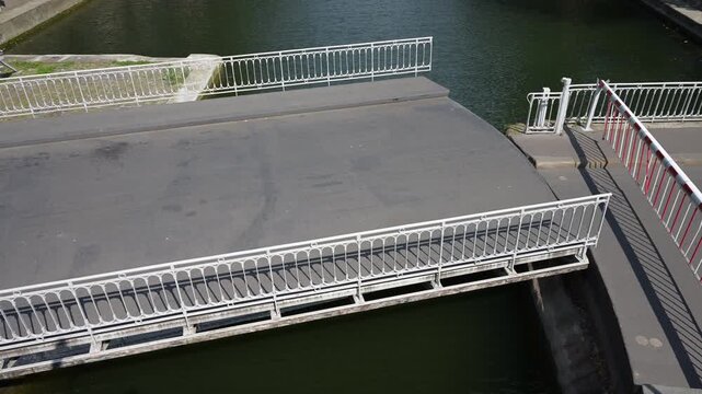 Mobile bridge moving to let the boats to cross the canal