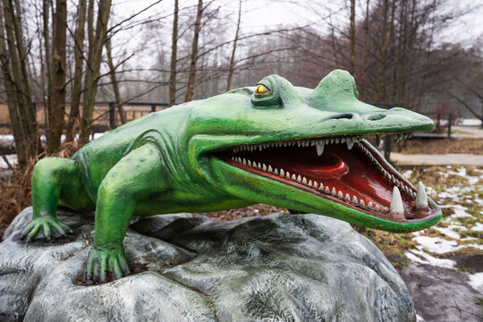 Life-sized realistic model of a Mastodonsaurus with open jaws showing sharp teeth, 