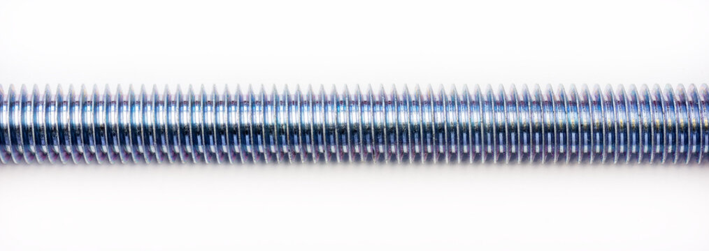 thread on steel stud on a white background close-up