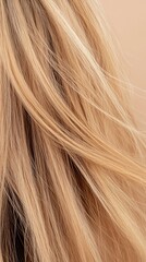 Fototapeta premium Close view of dry hair showing damage and split ends under light. The background is blurred, focusing entirely on the hair texture and condition