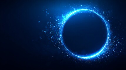 Fototapeta premium A glowing blue circle with sparkling particles against a dark background