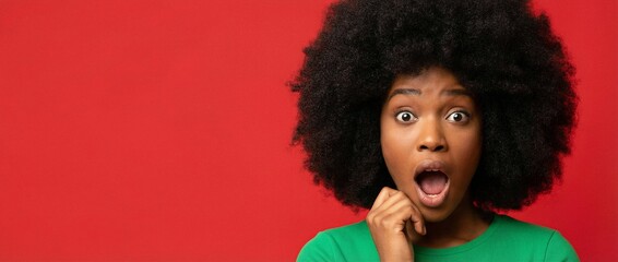 Startled: Capturing a raw moment of shock and surprise, this portrait of a woman showcases a compelling expression of awe and disbelief against a vibrant red backdrop.