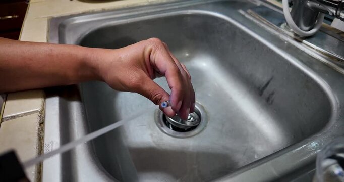 Close-up video shows a fountain pen component cleaned with compressed air before refilling, highlighting careful hand work, debris removal, and precise steps that restore smooth and reliable ink flow.