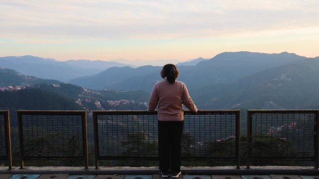solo woman embracing nature at hill station scenic viewpoint