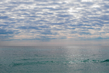 Nerja Beach Waves Under Cloudy Sky