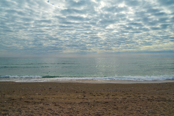 Nerja Beach Waves Under Cloudy Sky