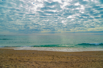 Nerja Beach Waves Under Cloudy Sky