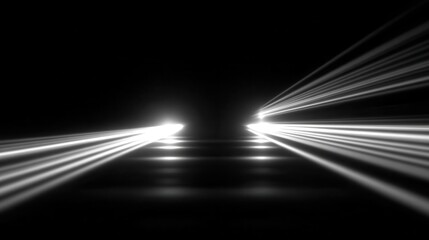 Bright lights shine in a dark space creating a powerful effect of beams in motion through fog