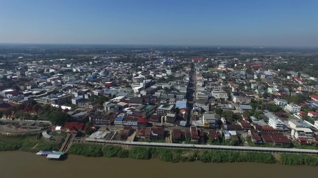 Aerial view of Nakhon Phanom city skyline along the Mekong River, Thailand.