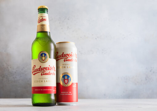 LONDON,UK - OCTOBER 26,2025: Budvar original czech lager beer in aluminium can and bottle on light table background.