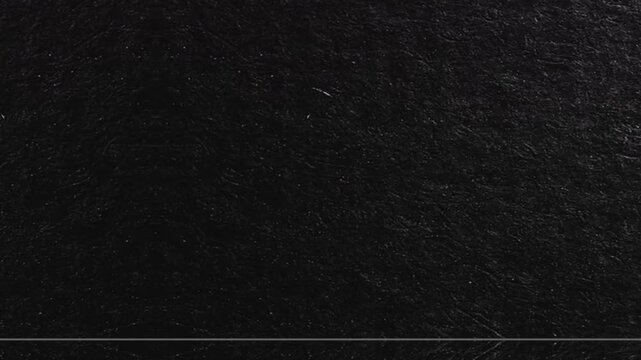 Crumpled black paper texture animated background
