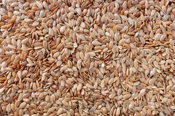 Close up photo of flax seeds, selective focus.