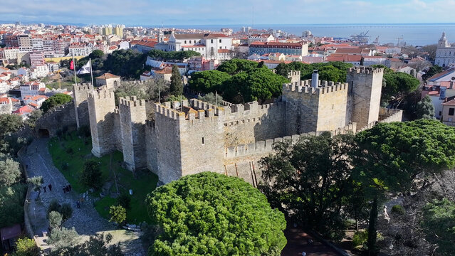 Sao Jorge Castle In Lisbon Portugal. Aerial View Of Landmark Medieval Building In Downtown Scene. Town Clouds Sky Backgrounds Urban. Backgrounds Downtown Panoramic City. Lisbon Portugal.