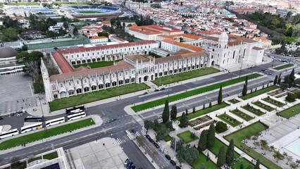 Obraz premium Jeronimos Monastery In Lisbon Portugal. Aerial View Of A High(Rise Buildings And Traffic Showcasing Urban Life. Town Sky Clouds Backgrounds Urban. Town Outdoor Downtown Panning Wide. Lisbon Portugal.