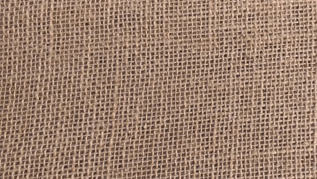 Jute pattern, rough burlap texture, canvas coarse cloth, brown woven rustic bagging. Natural hessian beige textile texture. Linen fabric backdrop. Threads background. Sackcloth surface, material.