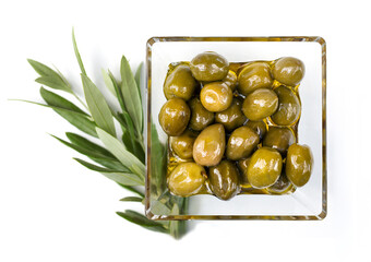 glass bowl filled with green olives