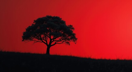 Silhouette of a tree on a hill with a red sky red black background