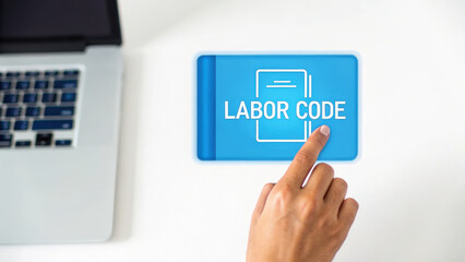 Labor law concept with legal advice for business shown on digital tablet held by hand near laptop on white desk