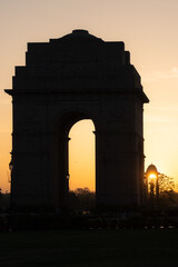 Fototapeta premium India Gate and Netaji Subhas Chandra Bose Canopy silhouette during sunrise - New Delhi, India