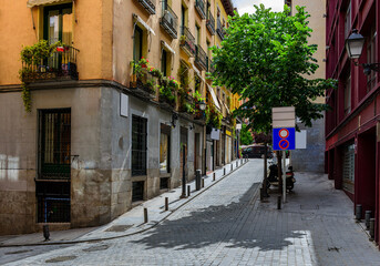 Cozy old street in Madrid, Spain. Architecture and landmark of Madrid, postcard of Madrid.