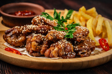 Fototapeta premium Crispy Fried Chicken Wings With Fries