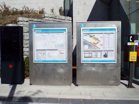 Ottawa, ON, Canada-July 12,2025: "Two silver transit information kiosks" display maps and schedules at the Uplands light rail station on Uplands Drive.