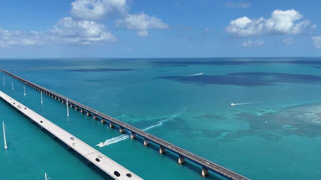 Boat traveling under the old, historic overseas highway and the newer highway at Marathon in the Florida Keys, United States 