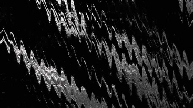 Abstract background of silver liquid metallic waves with moving zigzag ripples on black surface with cinematic texture aesthetic and copy space