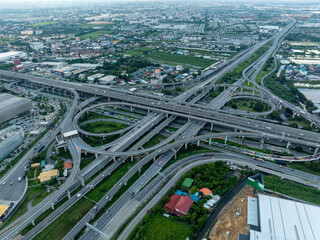 Aerial View Of Complex Highway Interchange With Traffic Flowing Through Multi Level Flyovers In Urban Cityscape