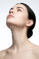 Neck lift rejuvenation concept - beautiful woman with medical aesthetic visualization showing anti-aging treatment zones © Ahmet  Aglamaz