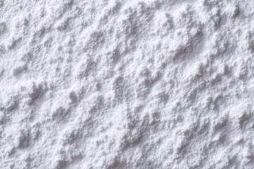 Obraz premium Close view of white powdery substance covering a surface in a winter setting during daylight hours